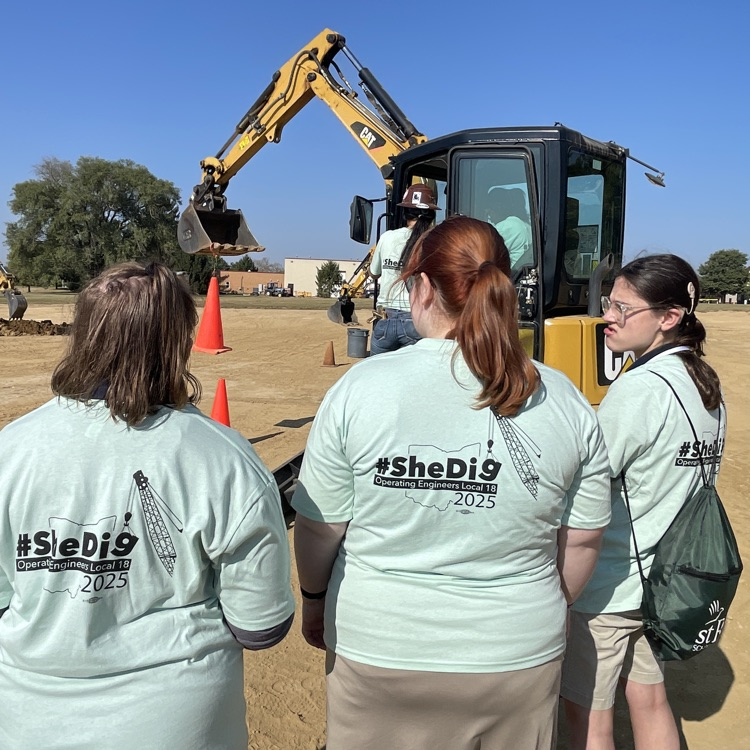 students observing construction work