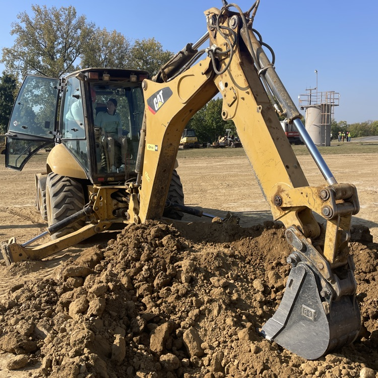 Student operating construction equipment 