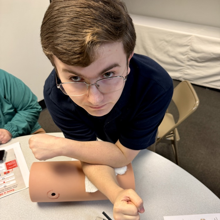 students taking a stop the bleed training