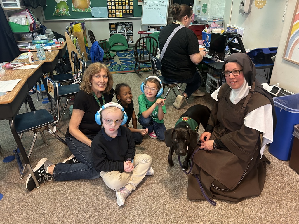 The  Daughters of Elias recently visited St. Rita School to pick up blankets, hygiene bags, and food bags that the students and staff put together as part of Catholic Schools  Week.  While they  were here, they met with different grades so the students could  enjoy  the therapy dog named "Stella"!  They got to see her dance and do various tricks.  The best part was getting to pet her and give her a lot of treats.  The Sisters plan on bringing Stella back in the Fall so more students can enjoy her.