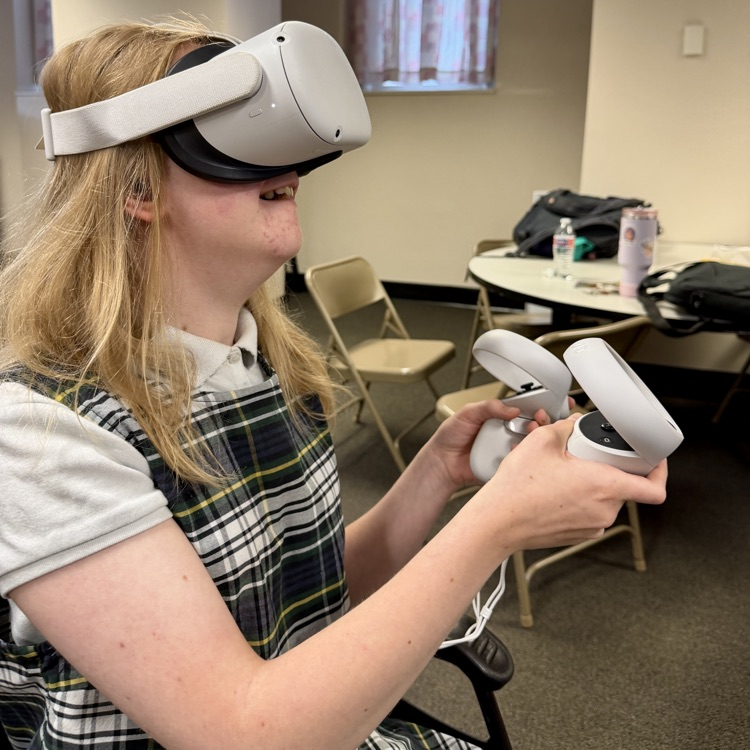 a student is using a VR headset to explore career simulations
