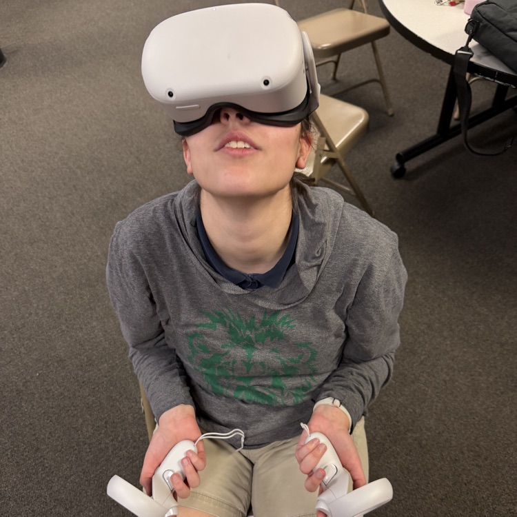 a student is using a VR headset to explore career simulations