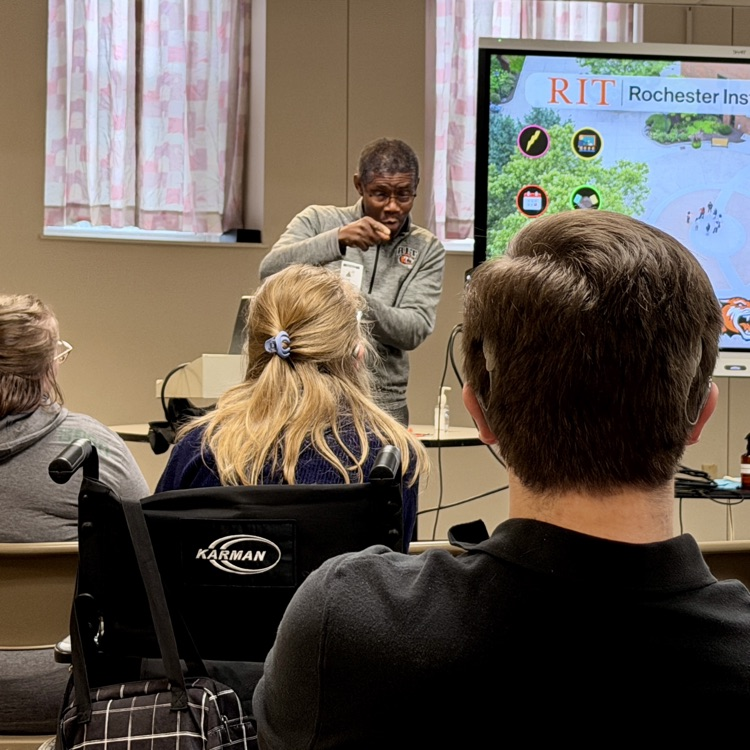 students are watching a presentation about RIT/NTID
