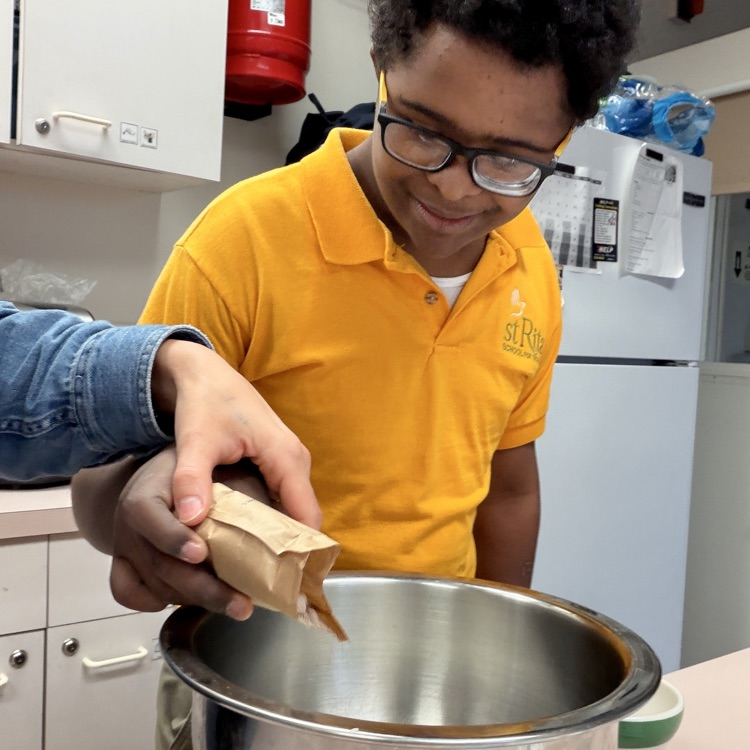 a student is making pudding in home ec