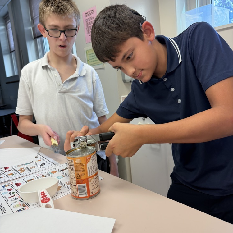 two students opened a can of pumpkin puree