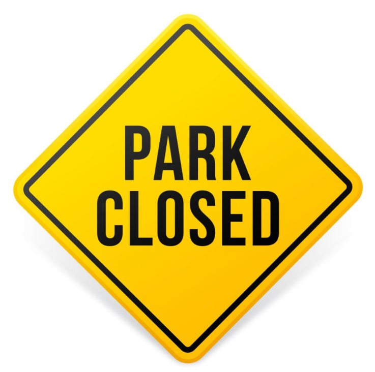 Yellow diamond-shaped warning sign with black border and bold black text reading “PARK CLOSED.”