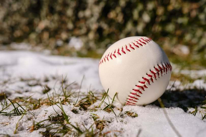 baseball sitting on melting snow