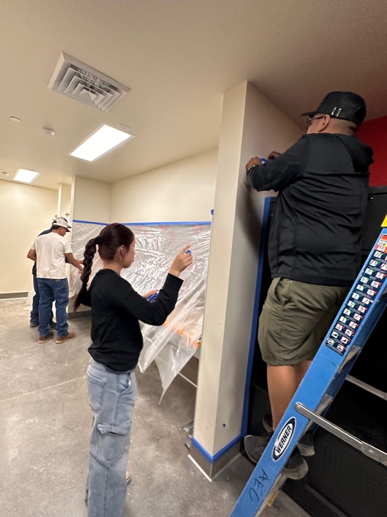 taping around fixtures in the locker rooms