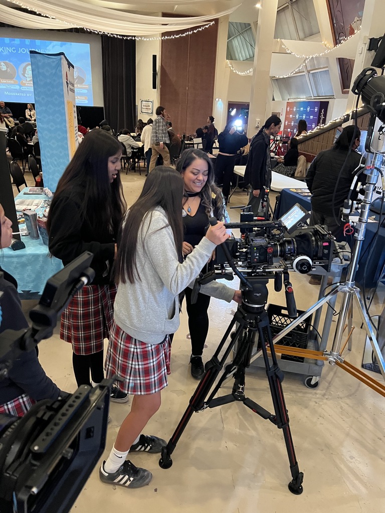 Student holding a camera