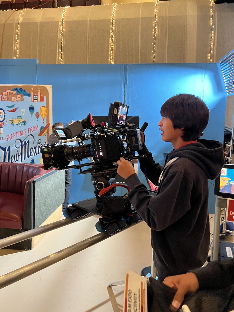 Student holding a camera