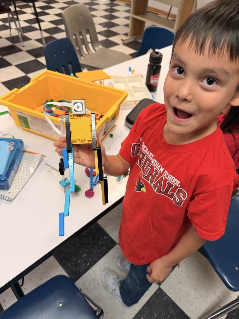 Students are building robots with Legos in the 1st Grade STEM lab