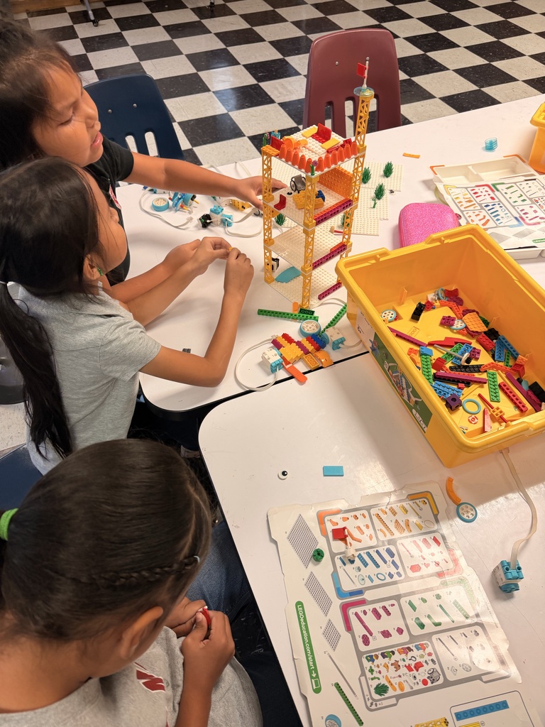 Students are building robots with Legos in the 1st Grade STEM lab