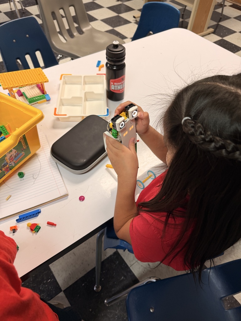Students are building robots with Legos in the 1st Grade STEM lab