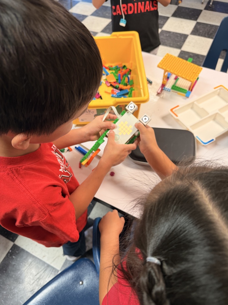 Students are building robots with Legos in the 1st Grade STEM lab