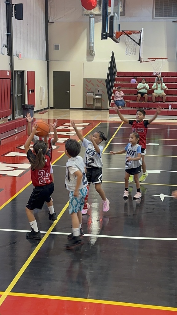 Girls shooting basketball