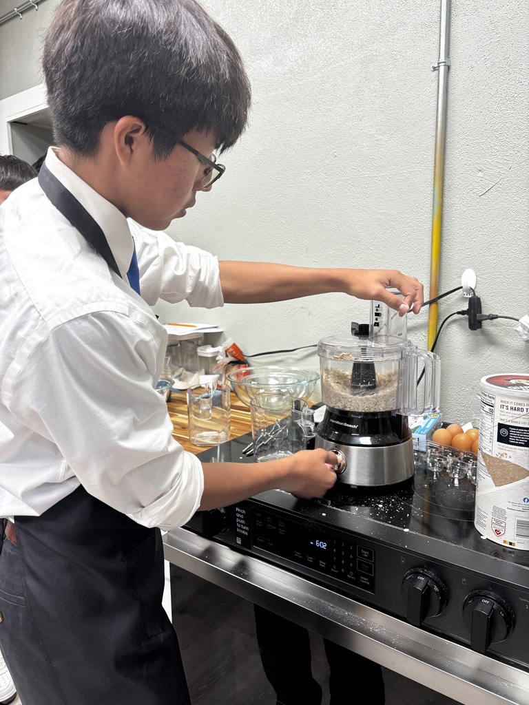 Student making their own oat flour