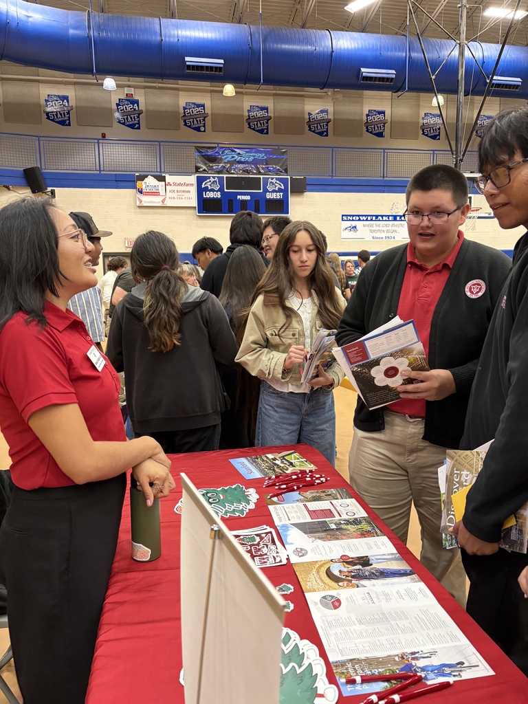 Trace Tracy and Caleb John meeting with a Standford university rep