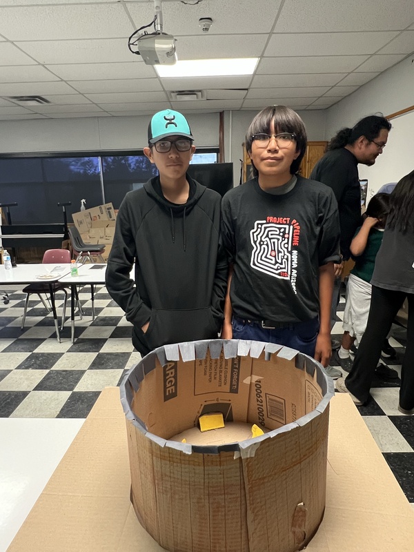 Students Showing off their building