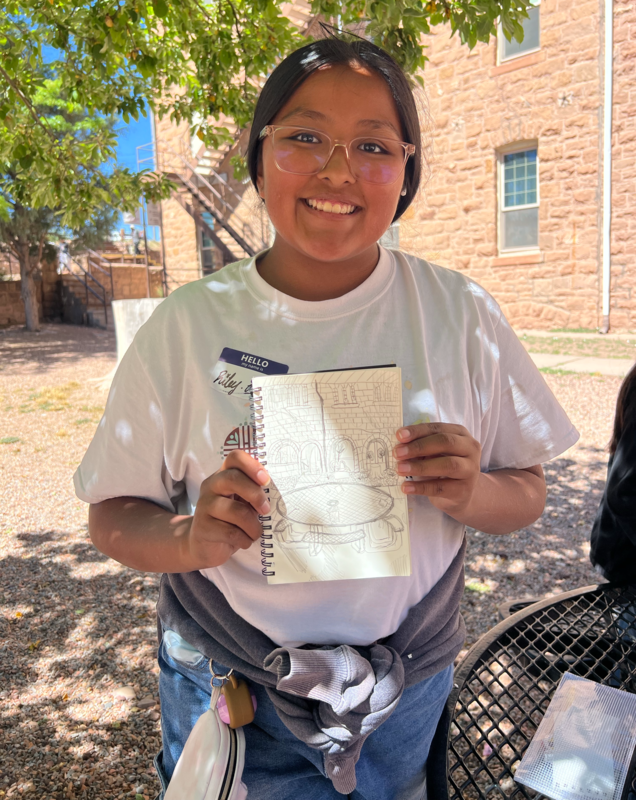 Student showing off their sketch