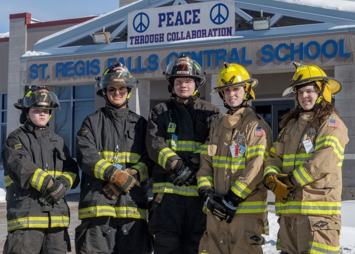 Small group of male high school students in their firefighting gear