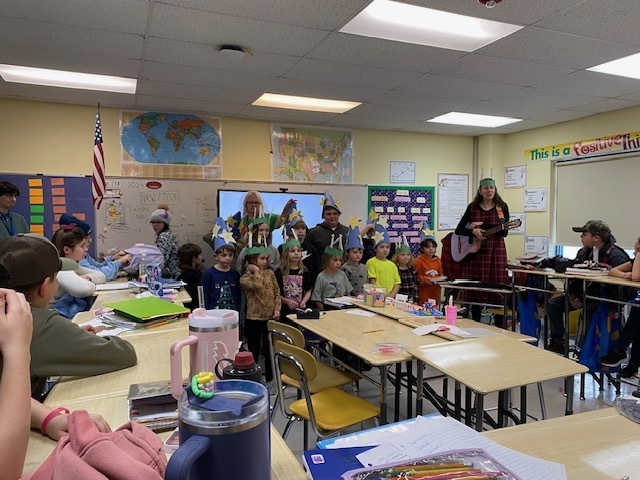 Students carrying out Saint Lucia Day traditions in classrooms.