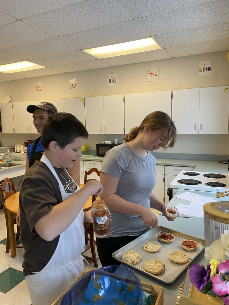 kids preparing pizza muffins 