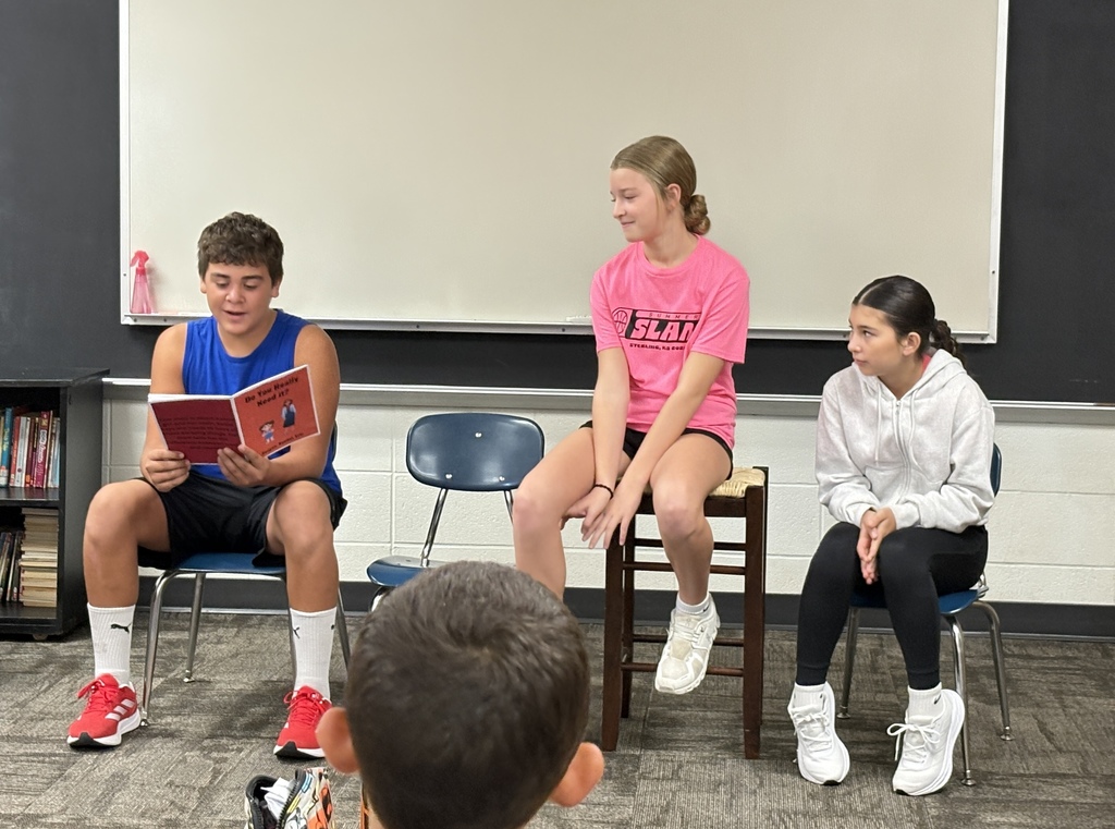 8th graders reading to 3rd graders