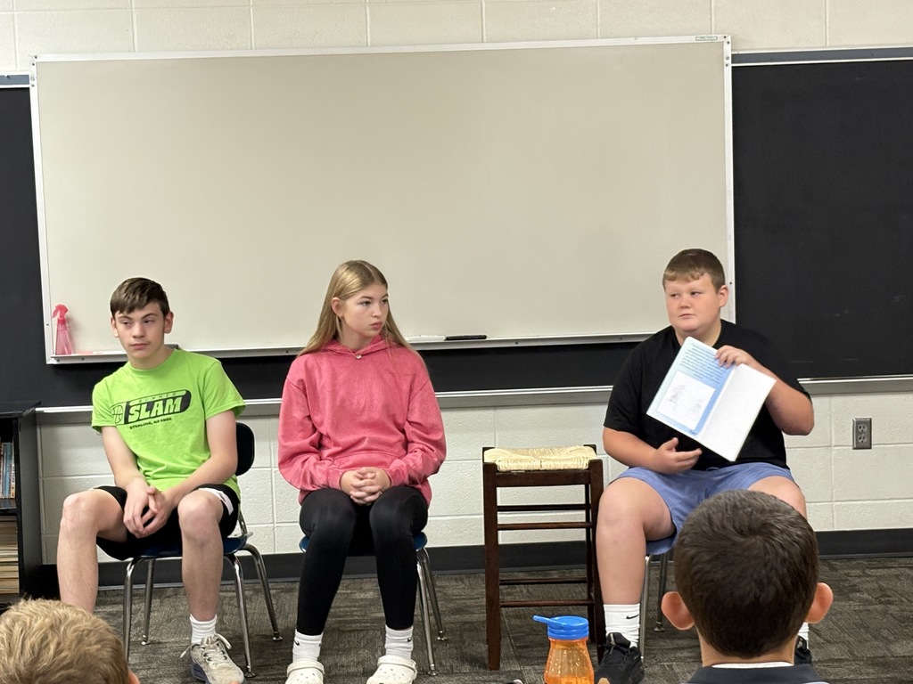 8th graders reading to 3rd graders