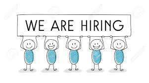 People holding a sign that says "We are hiring"