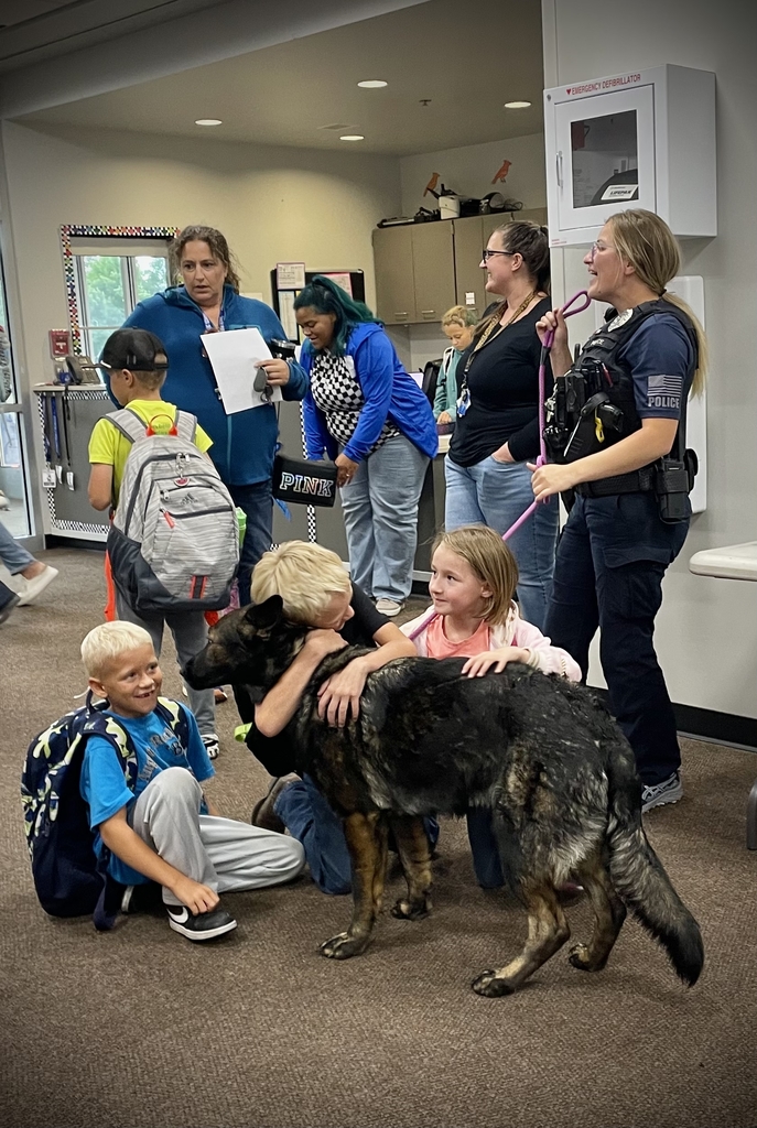 Students petting a police canine