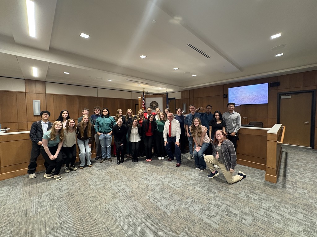 Group picture of mock trial teams, jury members, and presiding judge.