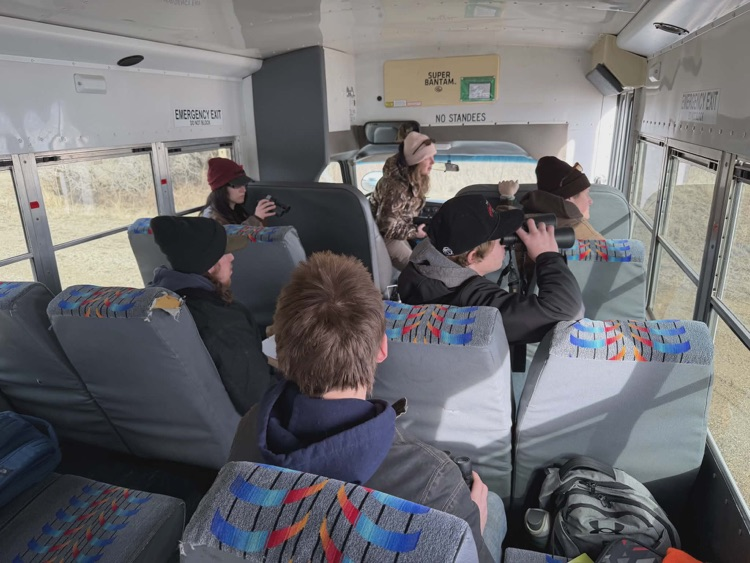 kids sitting on a bus