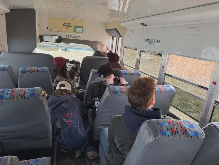 more kids sitting on a bus