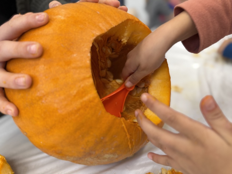 Digging out seeds and pulp.