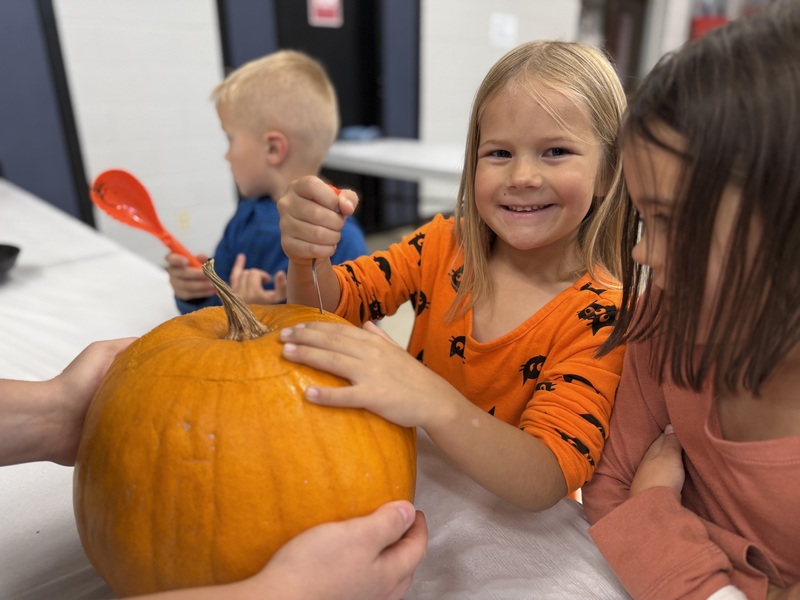 Carving pumpkins.