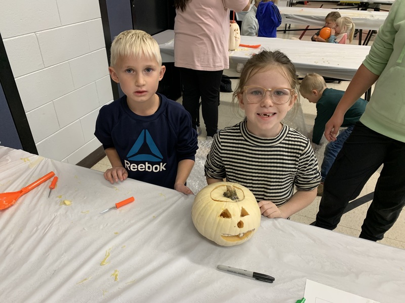 Students with jack o’ lanterns.