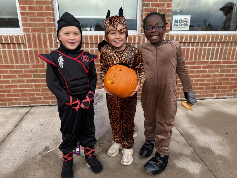 Showing off the pumpkin.