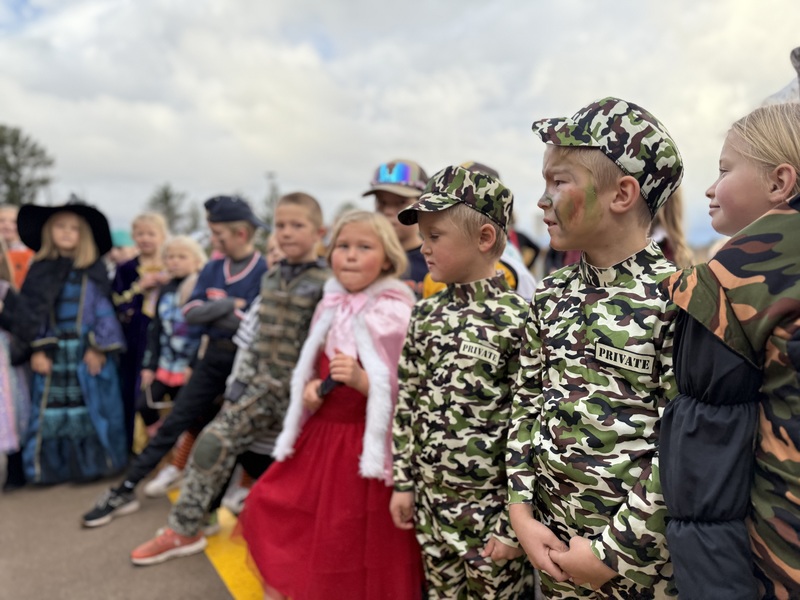 Kids watching pumpkin drop.