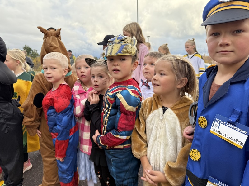 Kids watching pumpkin drop.