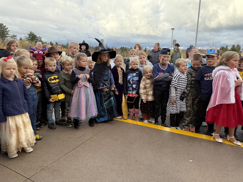 Kids watching pumpkin drop.