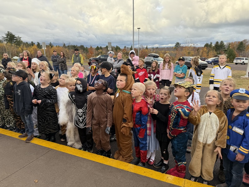 Kids watching pumpkin drop.