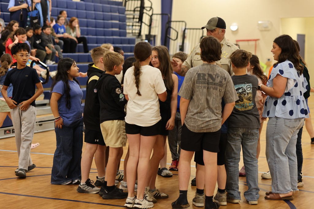 group of kids with St. John
