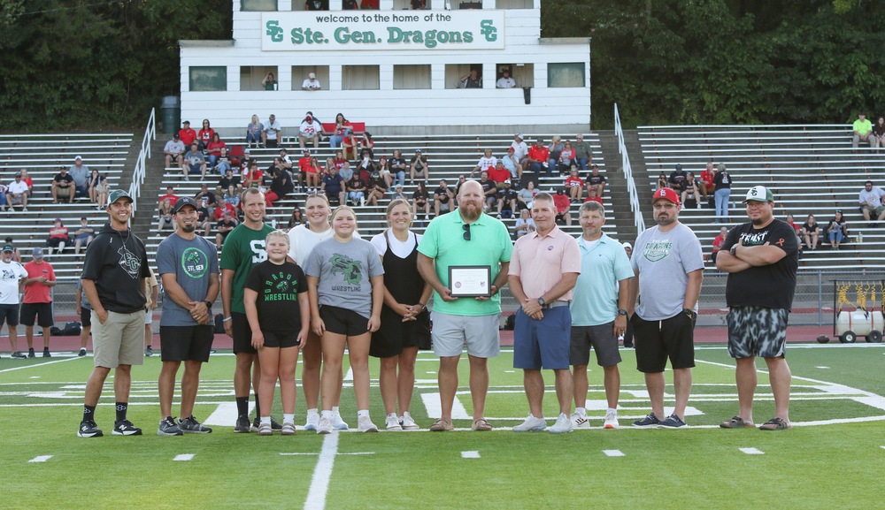 Coach Bonnell accepts his plaque.