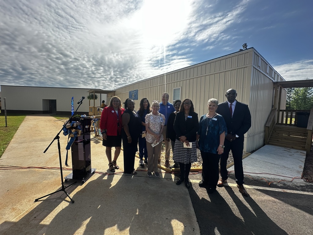 Community stakeholders who attended the ribbon cutting ceremony for the new School-based health clinic