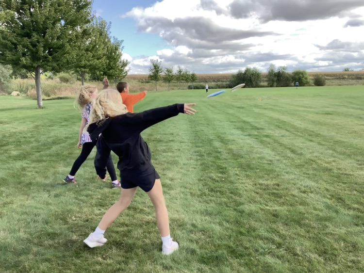 Upper 3rd grade playing frisbee golf 