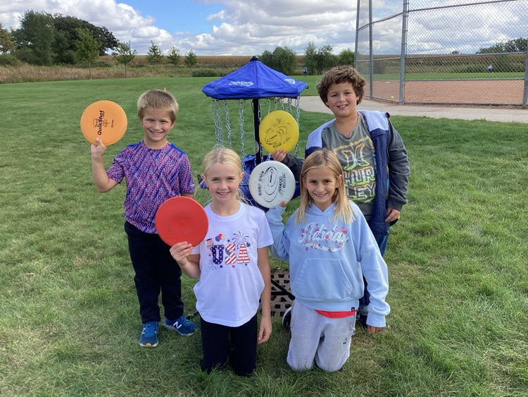 Upper 3rd grade playing frisbee golf 