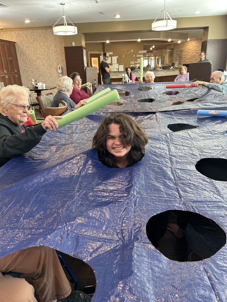 Resident Wacking a student with a pool noodle.