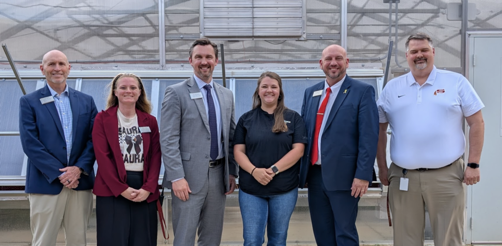 Sawyer Ferguson with Admin and District Saff