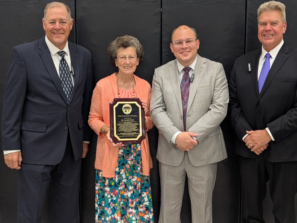 Lannette Moore with the BOE members - April employee of the month 