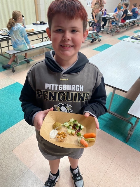 student holding food choices
